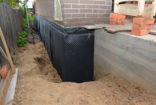 Happy homeowners after waterproofing job in Algonquin